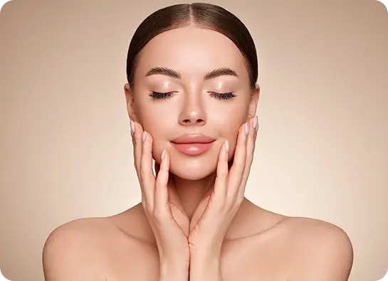 Woman with clear skin gently touching face